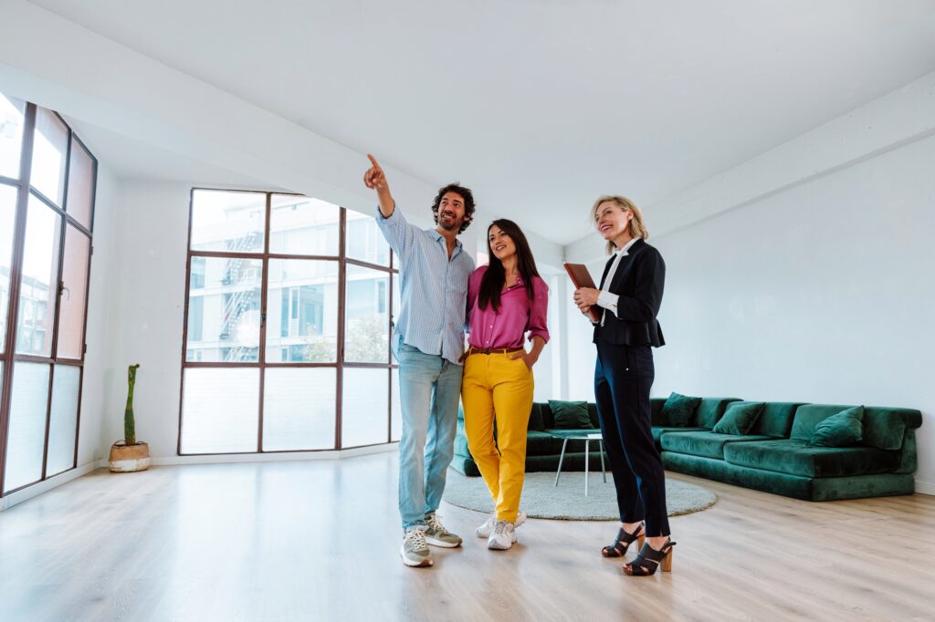 Real estate agent showing an apartment to a couple.